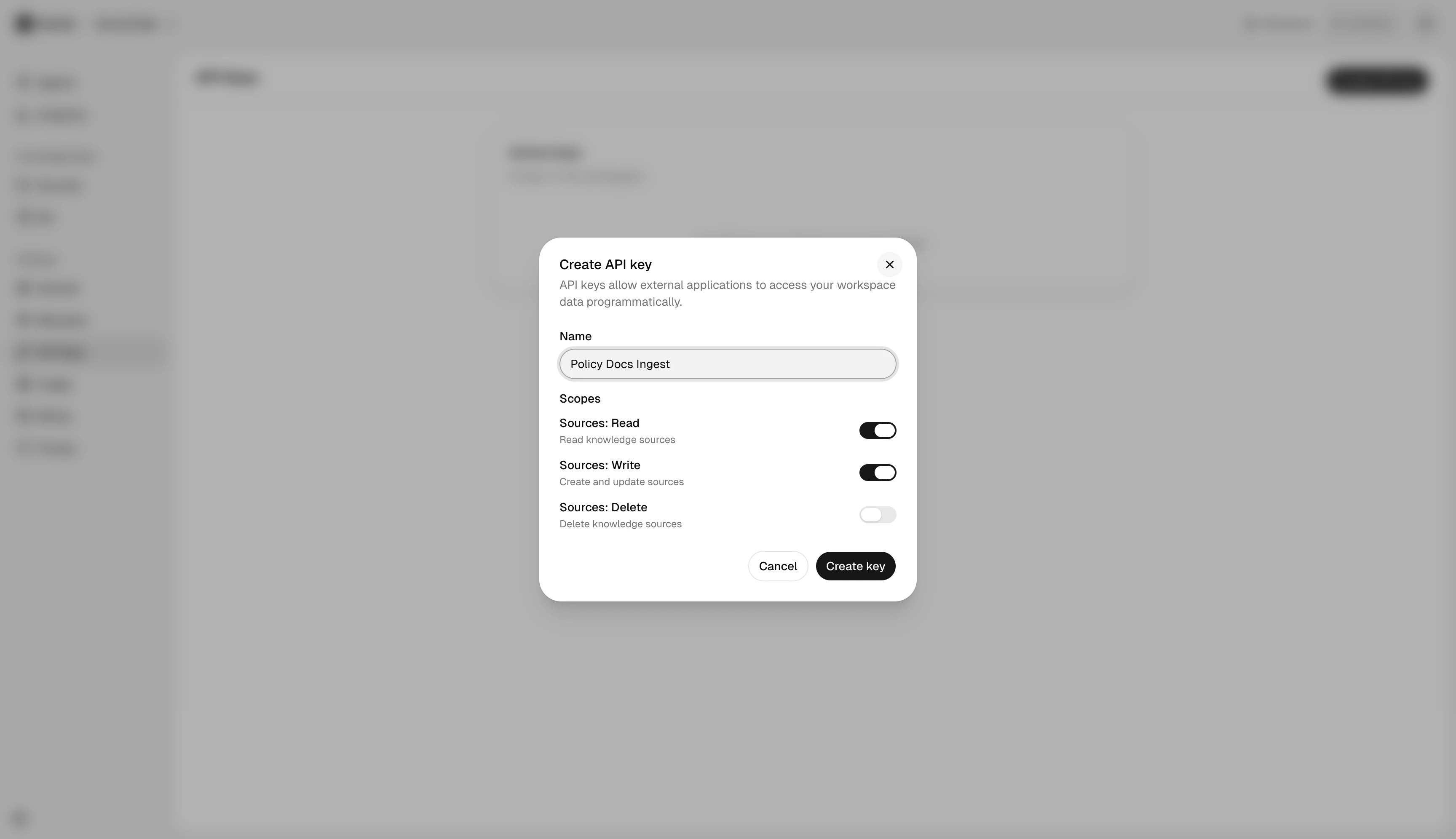 Create API key dialog with name field and scoped source permissions.
